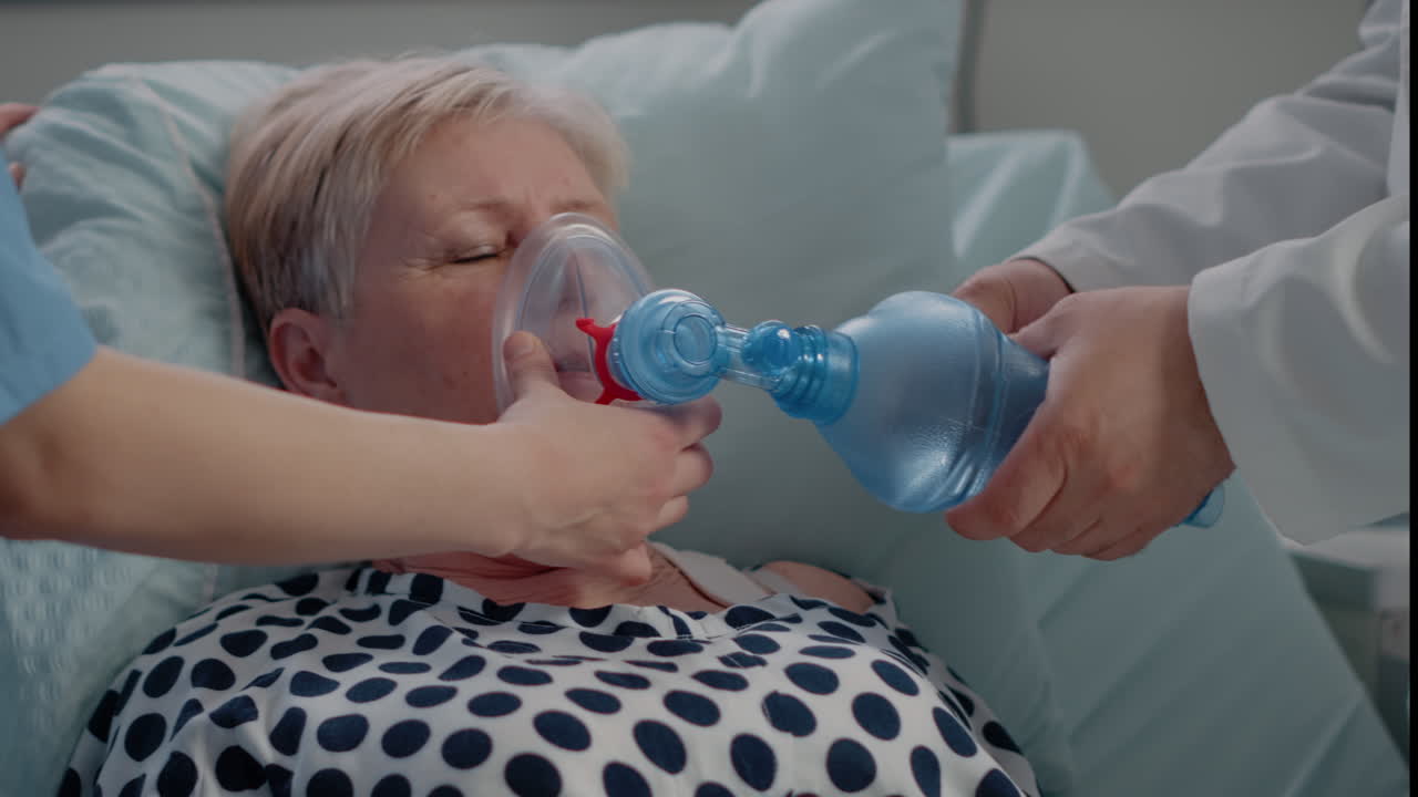 Close up of sick patient receiving help with oxygen tube
