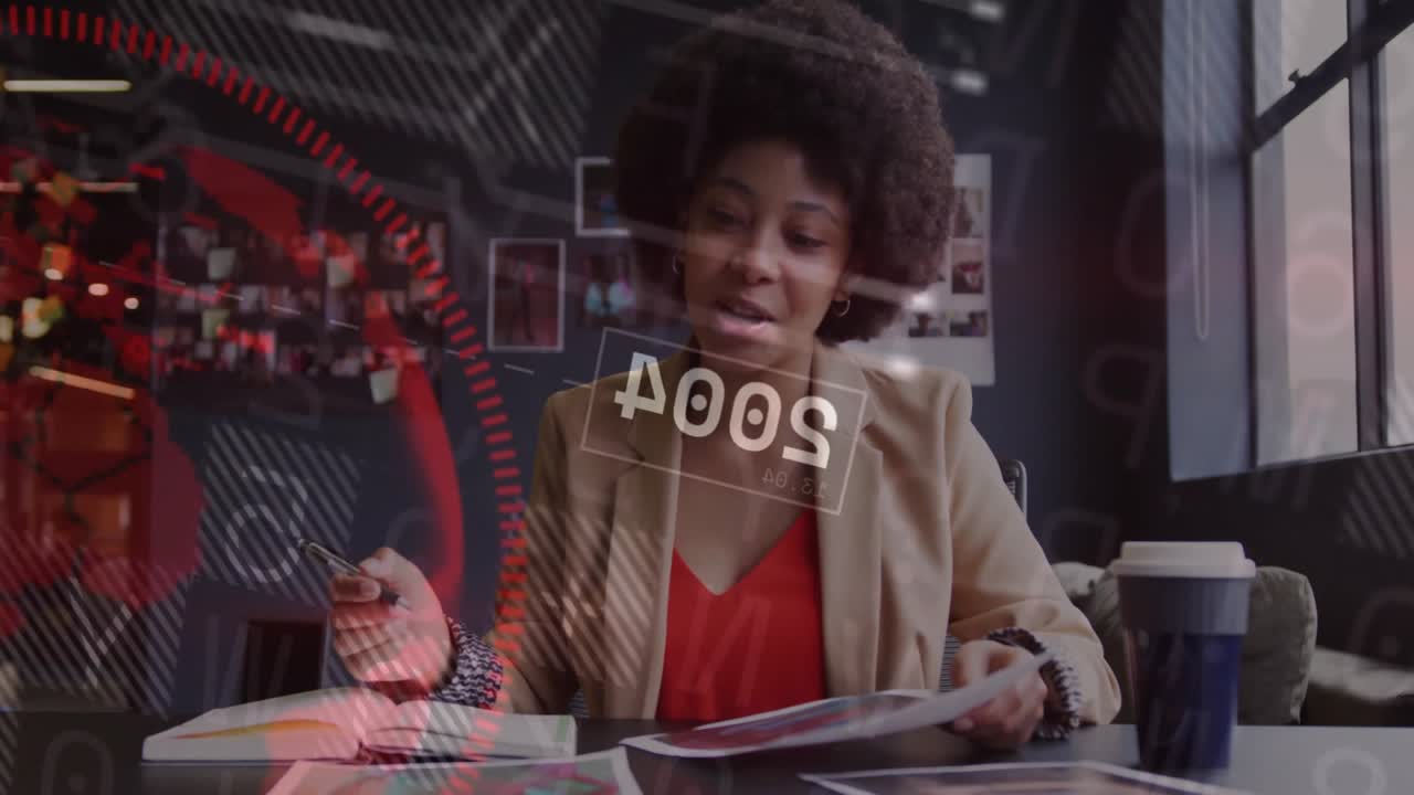 Woman flipping notebook pages while animating real-time data overlays and analyzing business charts