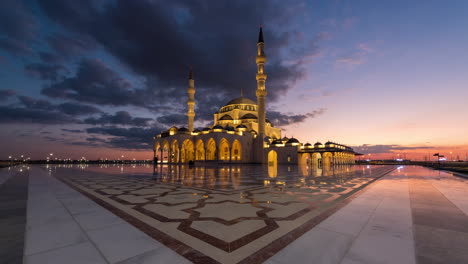 4k day to night timelapse of sharjah mosque, uae.