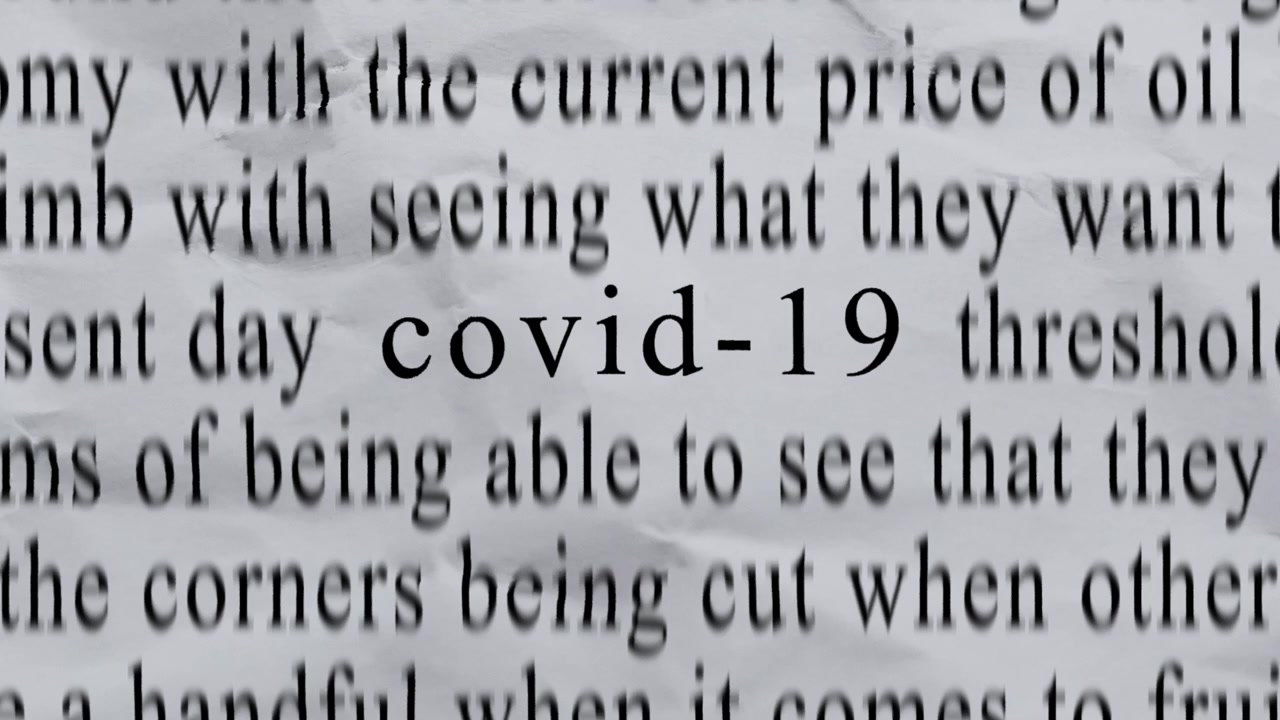 COVID-19 Text in Centre with High-energy Fast Text Stop-Motion Writing Cycling Rapidly on Crinkled Texture Paper. Newspaper Cuttings Style animation. 4K.