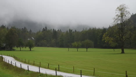 Rainy-day-in-Alpine-valley-with-low-clouds,-Logarska-dolina,-Slovenia,-European-Alps,-bad-travel-weather,-hiking-in-mountains,-HD