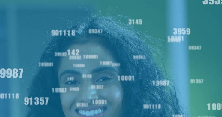 Animation of changing numbers over close up of smiling diverse female standing in office