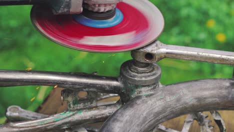 metal grinding machine repairing an old bicycle. fixing a bike