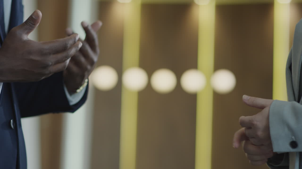 Business Partners Shaking Hands and Having Discussion