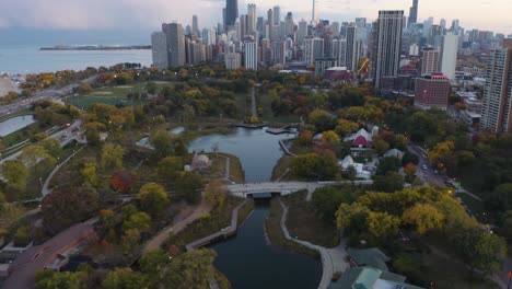 aerial pan up reveals lincoln park and chicago skyline