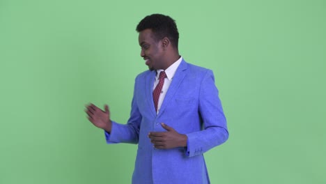 young african businessman with afro hair in suit