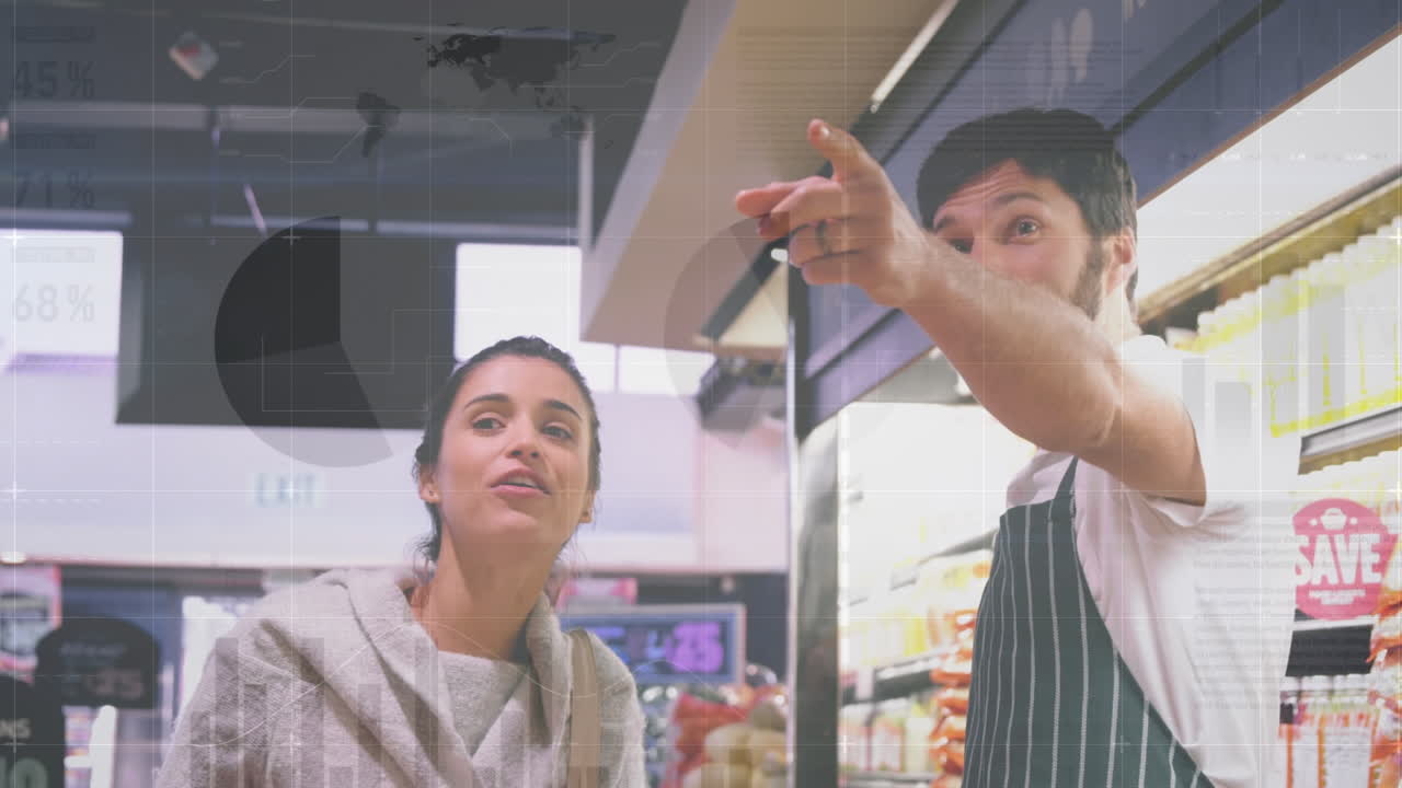 Animation of financial graphs over happy caucasian male seller and female customer in grocery shop