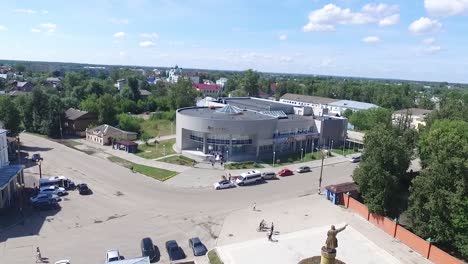 aerial view of a town square with a modern building