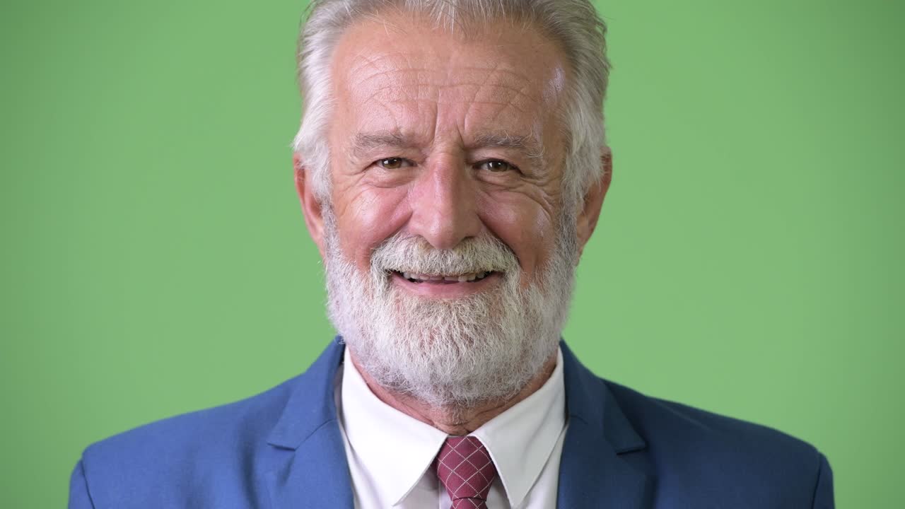 초록색 배경 에 있는 잘생긴 수염 이 있는 상인