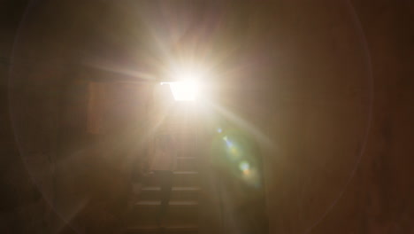 sunlight streaming through ancient stairway