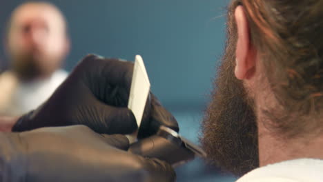 barber cleaning hair clipper