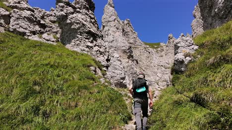 drone operator capturing action while climbs on mountains, dangerous passages, summer, italian alps. aerial