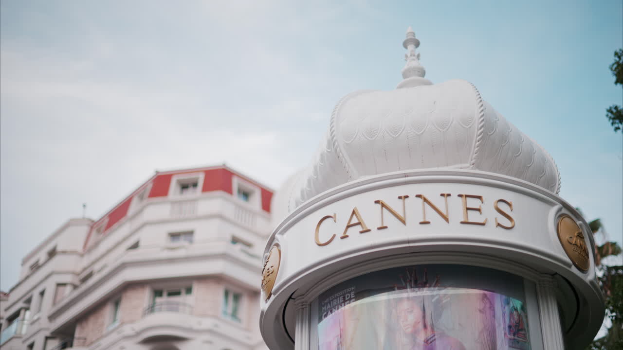 Cannes, France - October 14, 2024: White, rotating signboard with the words Cannes