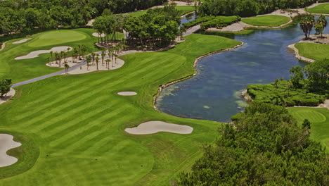 akumal mexico aerial v17 zoom shot, drone flyover pga riviera maya golf courses capturing beautiful landscape incorporating with mayan jungle and natural lake - shot with mavic 3 pro cine - july 2023