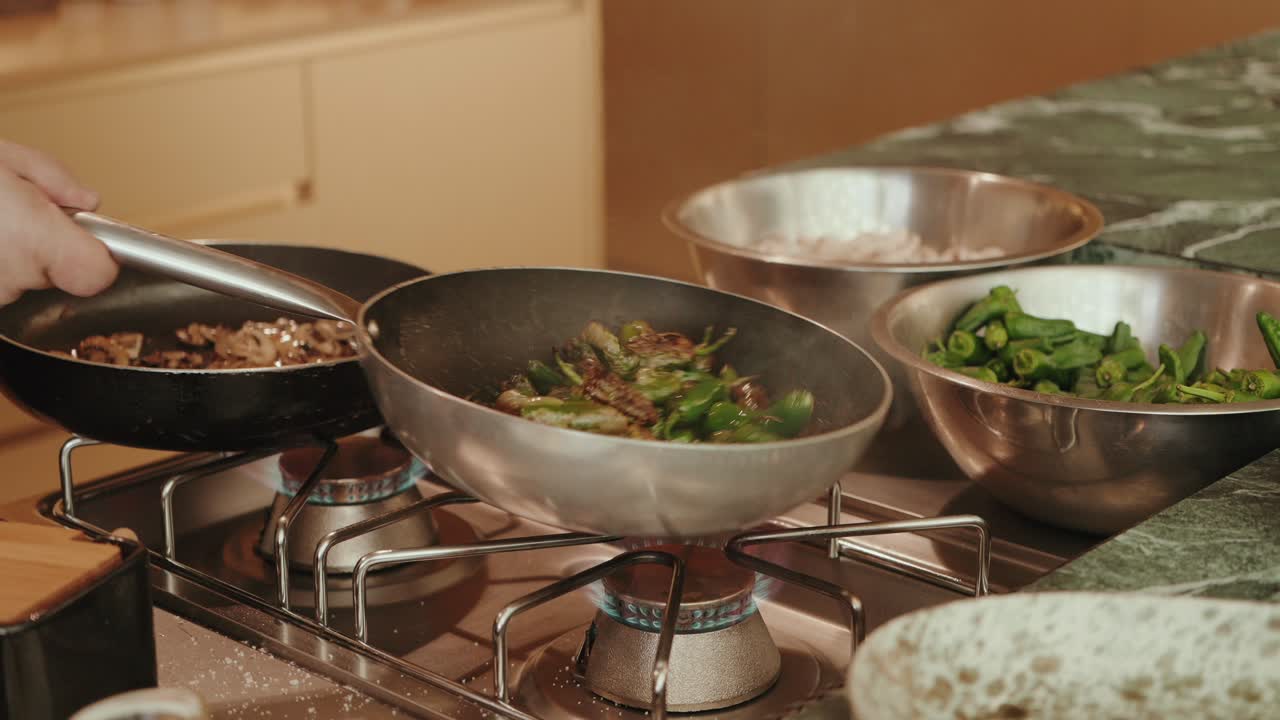 fresh vegetables being stir fried in pan over open flame in kitchen