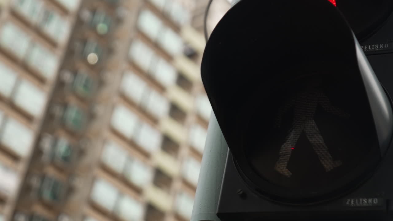 Close up shot of traffic light turn to green on road in Hong Kong Downtown
