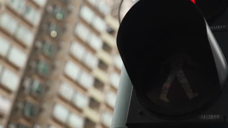 Close-up-shot-of-traffic-light-turn-to-green-on-road-in-Hong-Kong-Downtown