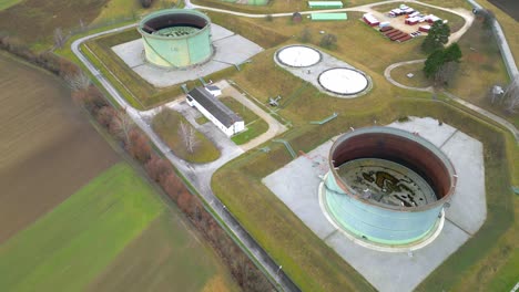 aerial view of gas tank with external floating roof in an industrial site at daytime