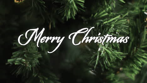 merry christmas text in white over close up christmas tree on dark background