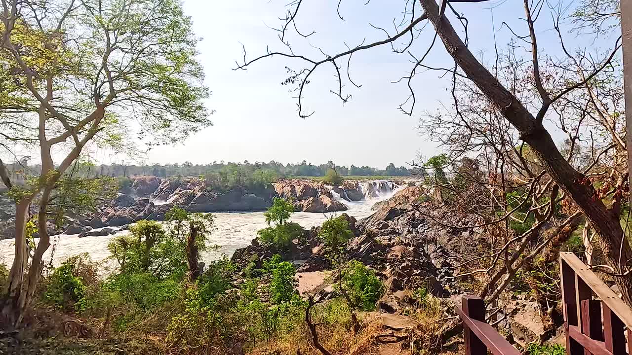 Breathtaking Waterfall View from a Wooden Deck