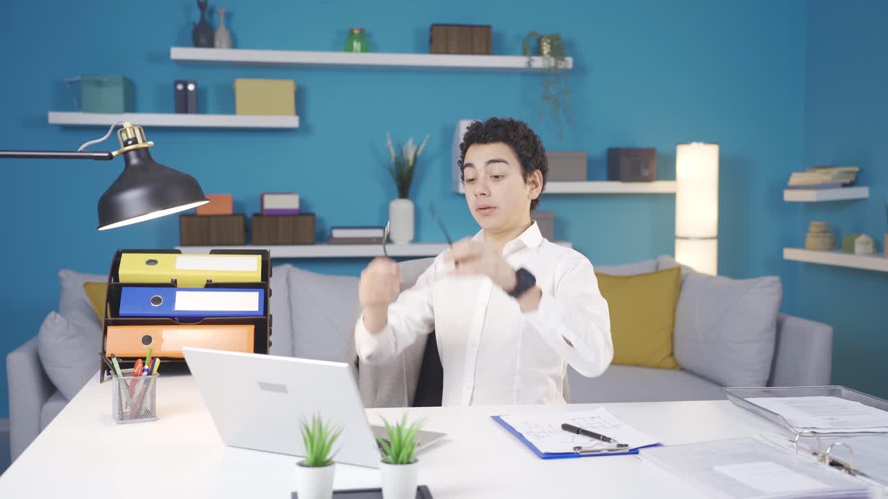 Spoiled and mischievous boy rummaging through his father's work laptop.