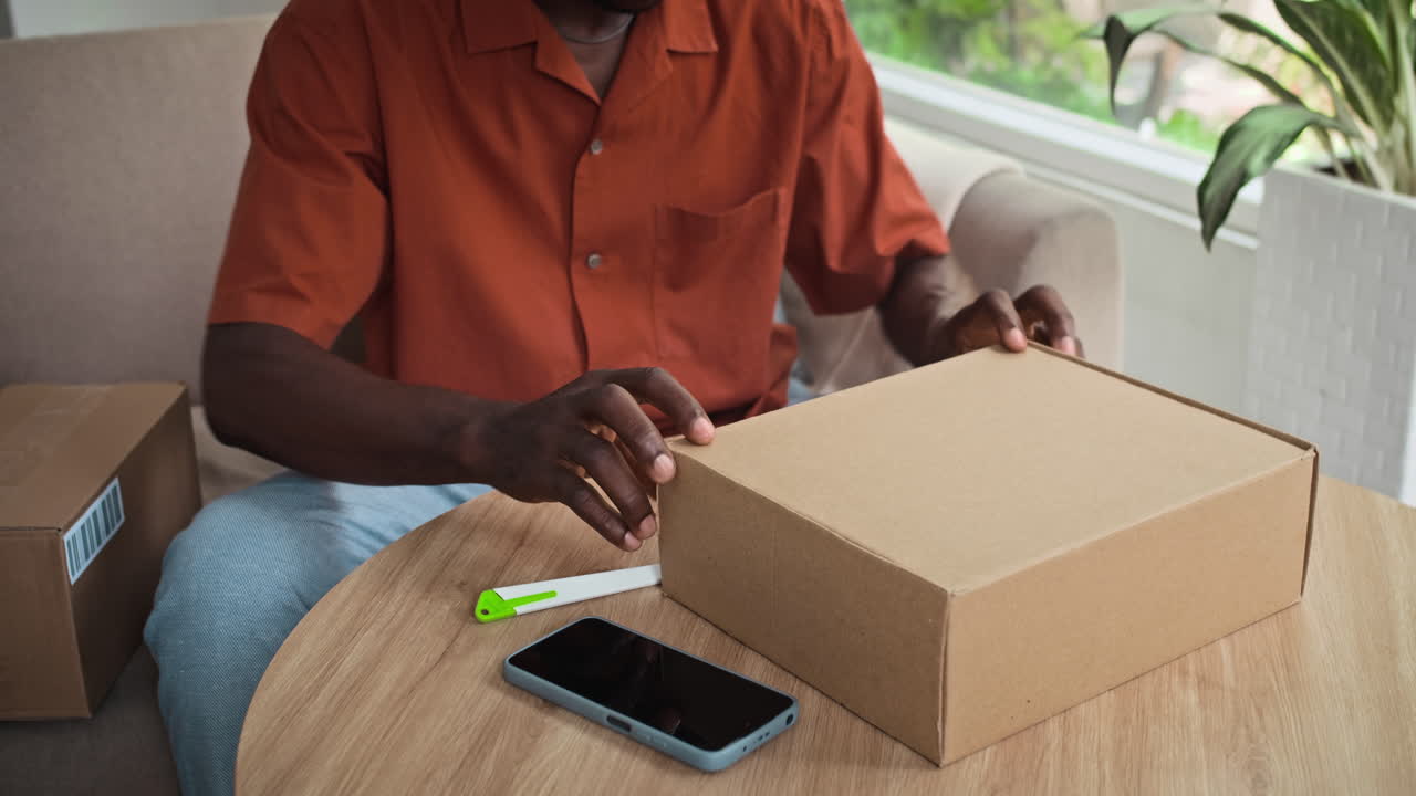 Black Man Checking Parcel with Leather Shoes