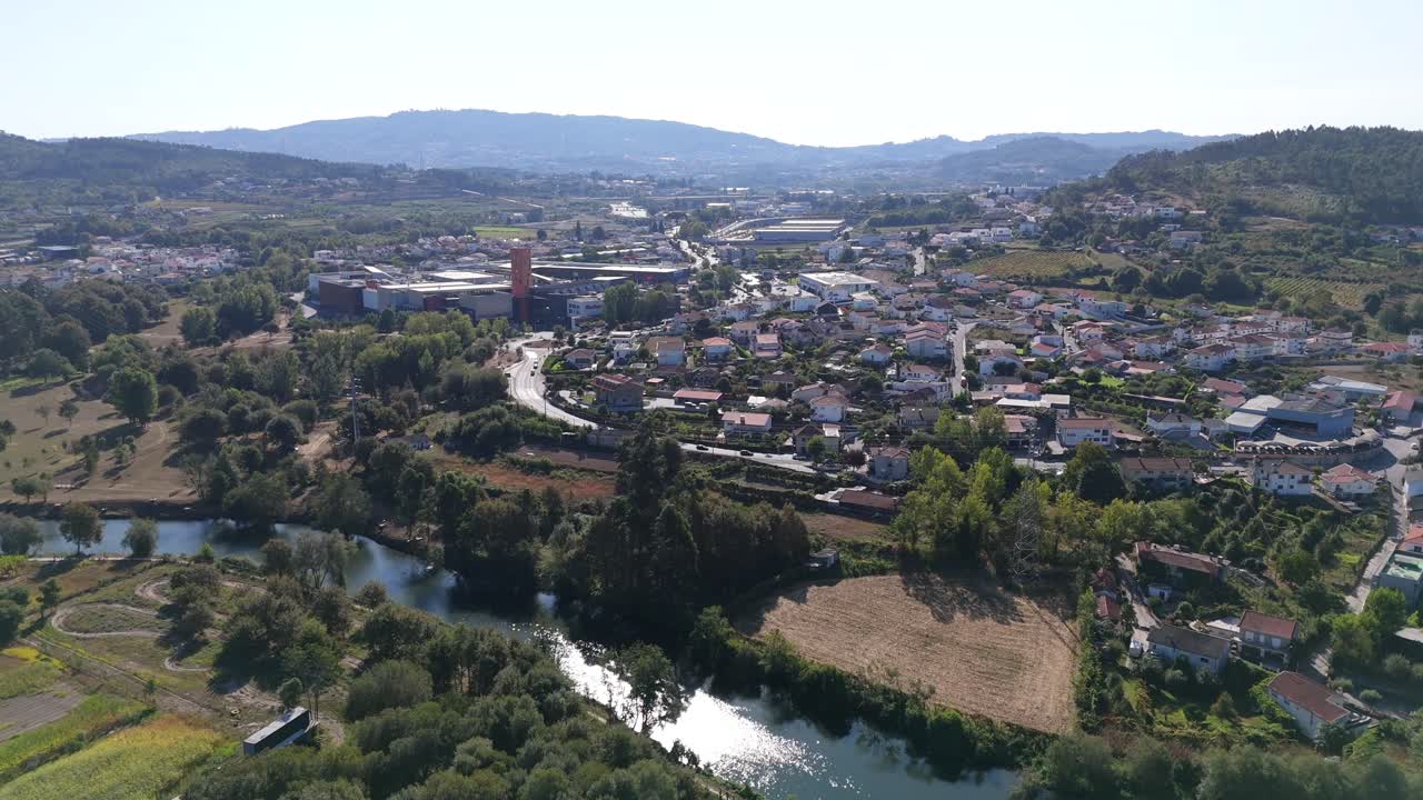 Aerial view of Ave River near Silvares Guimaraes Portugal surrounded by nature and town