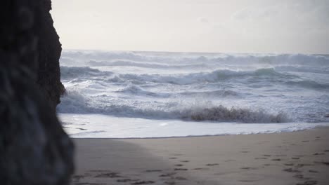Violent-Sea-waves-crashing-at-a-beach-of-Praia-da-Adraga-in-Portugal