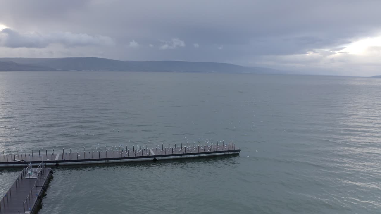 Pier over the Sea of Galilee on a Cloudy Day