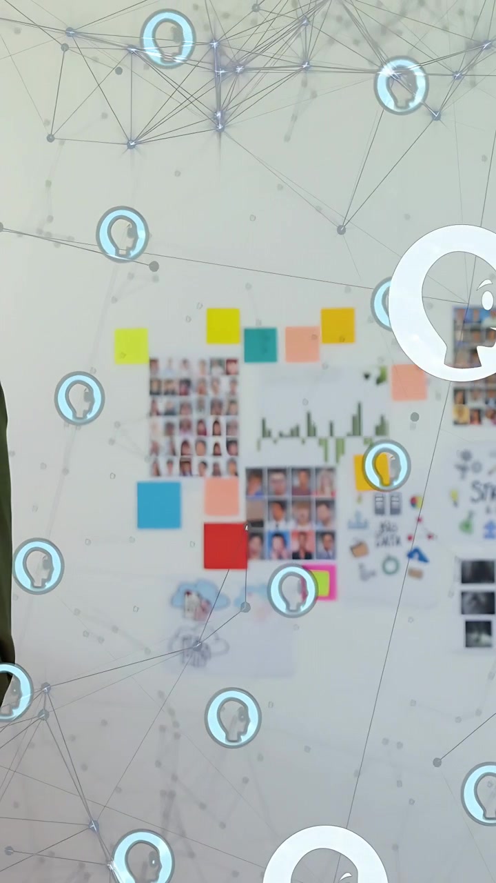 Vertical video: Man entering left opening laptop, checking design board while network icons moving