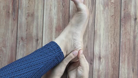 woman examining her heel