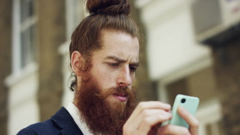Hipster-man-using-smartphone-touchscreen-connected-sharing-economy