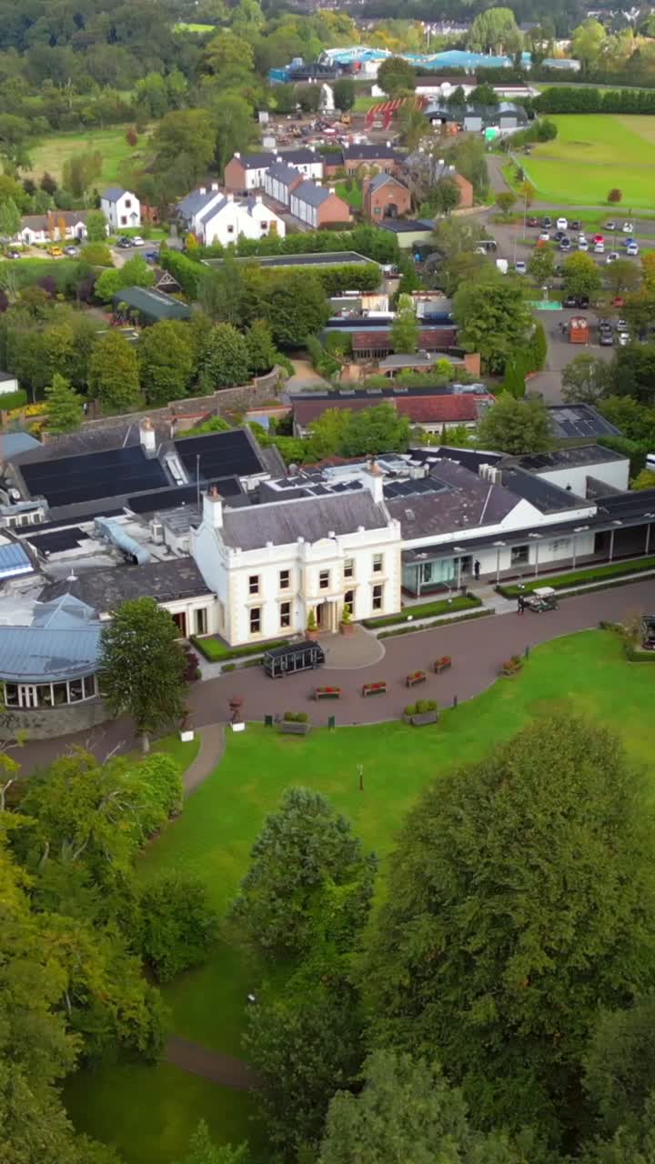 Overhead rotating social ratio 30FPS aerial of Galgorm Estate in Ballymena, County Antrim in Northern Ireland. Produced in 1080x1920 with broadcast ready Rec709 color
