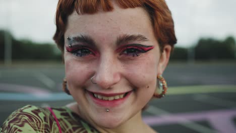 happy young girl smiling in front of camera outdoor