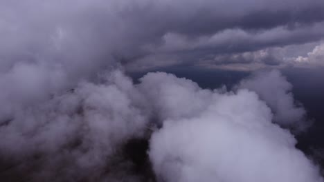 dark scene of a drone flying through the clouds