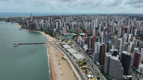 aerial view of fortaleza city skyline, beachside market, and beach in brazil.