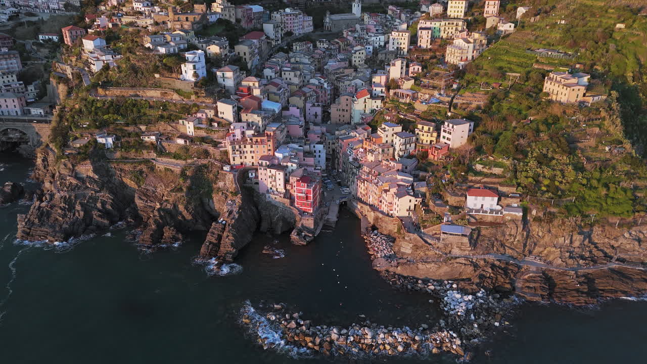 Colorful coastal town of Riomaggiore, Cinque Terre, shot from above at sunset