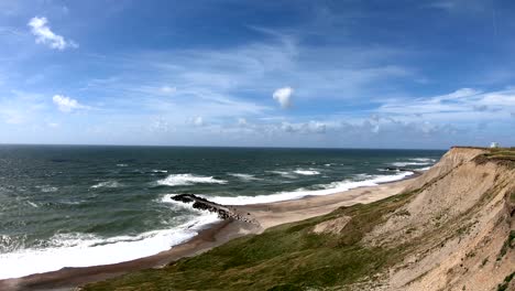 cliff with waves, north sea, jütland, holmsland klit, denmark, 4k