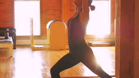 Woman-performing-stretching-exercise