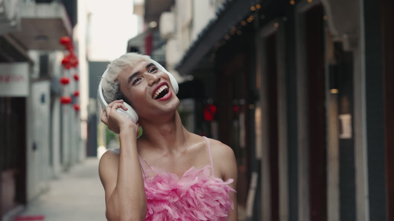 Man in Pink Feathers, Listening to Music in the City