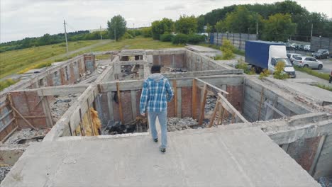 man walking on a damaged building