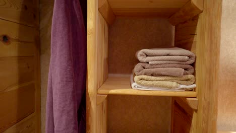 a purple towel on the side of the cabinet