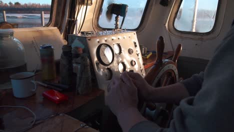 boat captain at the helm in winter