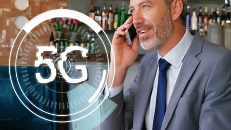 5g text on circles against businessman talking on smartphone