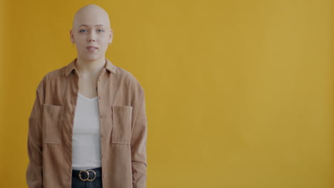 bald woman presenting