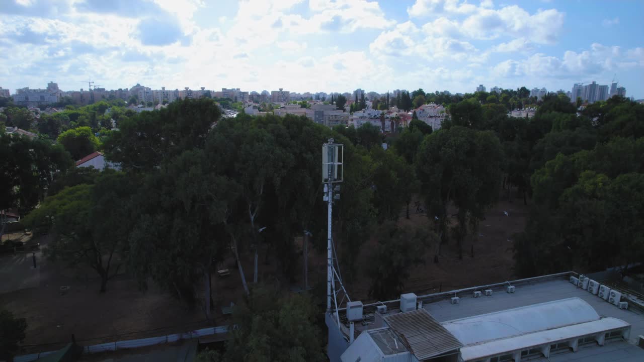 Telephone tower monopole next to an urban residential area