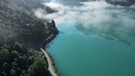 Flying-trough-the-clouds-over-beautiful-Lovatnet-lake-in-Norway