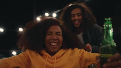 beautiful-young-woman-having-fun-sitting-in-shopping-cart-group-of-friends-enjoying-crazy-rooftop-party-at-night-playfully-celebrating-weekend