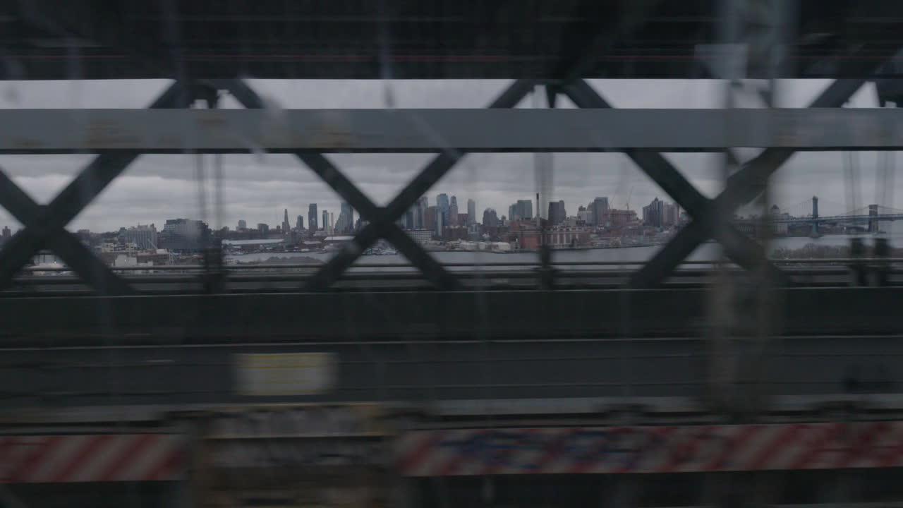 view of downtown Brooklyn NYC from a moving subway car
