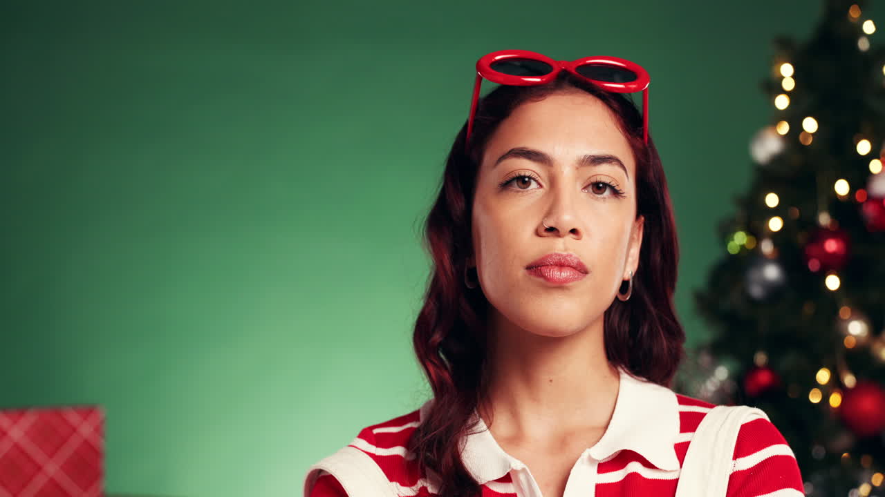 Woman in festive attire with Christmas tree